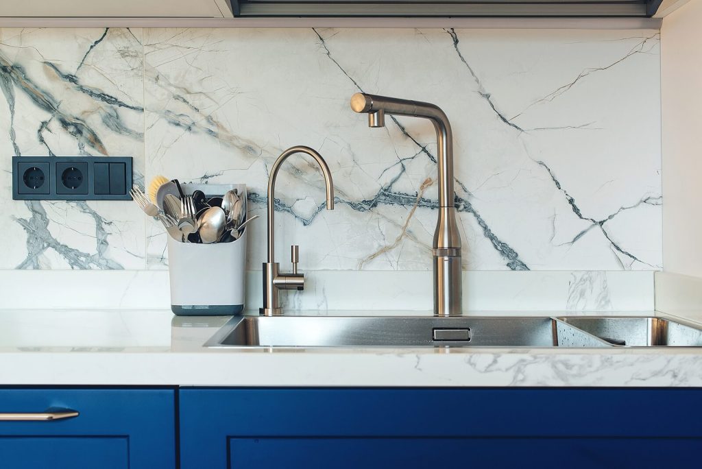 Close-up of a clean, modern kitchen sink.